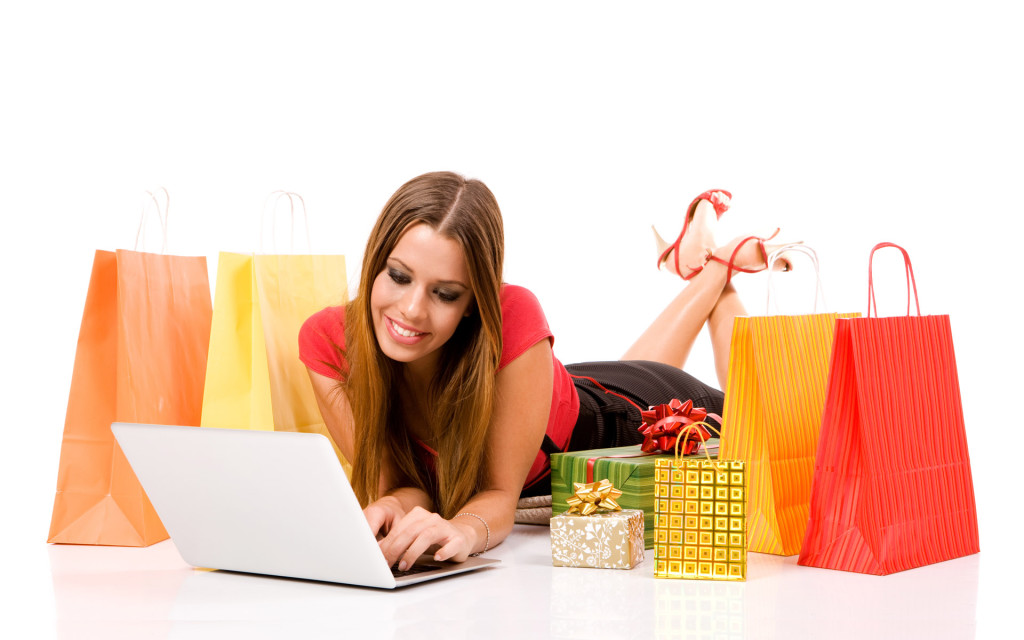 Beautiful young woman shopping over internet